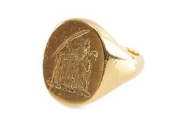 YELLOW METAL SIGNET RING, the oval front engraved with a lion rampant holding a quill, ring size