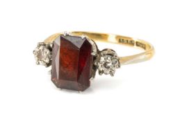 18CT GOLD & PLATINUM GARNET & DIAMOND THREE STONE RING, ring size O, 3.3gms Provenance: deceased