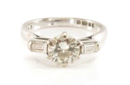 18CT WHITE GOLD SOLITAIRE DIAMOND RING, the round-cut central stone (1.0cts approx.) flanked by
