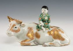 JAPANESE KUTANI PORCELAIN 'BOY ON BUFFALO' GROUP, Meiji/Taisho Period, 23cms (w) Comments:
