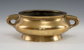 CHINESE BRONZE CENSER, Qing Dynasty, bombé form with twin loop handles, tapering foot, base with