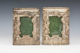 PAIR JAPANESE WHITE METAL PHOTOGRAPH FRAMES, repoussé decorated with dragons, pavilions and 'Nippon'