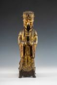 MING DYNASTY GILT LACQUERED BRONZE FIGURE OF AN OFFICIAL, late 17th C, standing in flowing robes