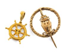 TWO 9CT GOLD NAUTICAL ITEMS, comprising a ships' wheel pendant and a ship's prow lapel pin, both