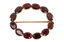 GEORGIAN FLAT-CUT ALMANDINE GARNET BROOCH, in unmarked yellow metal, oval, closed back setting,