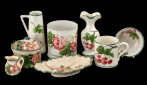 LLANELLY POTTERY GROUP OF EIGHT PIECES, decorated in roses and cherries, circa 1914 (8)
