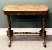 VICTORIAN WALNUT GAMES TABLE, revolving fold-over top with baize lined interior, turned end supports