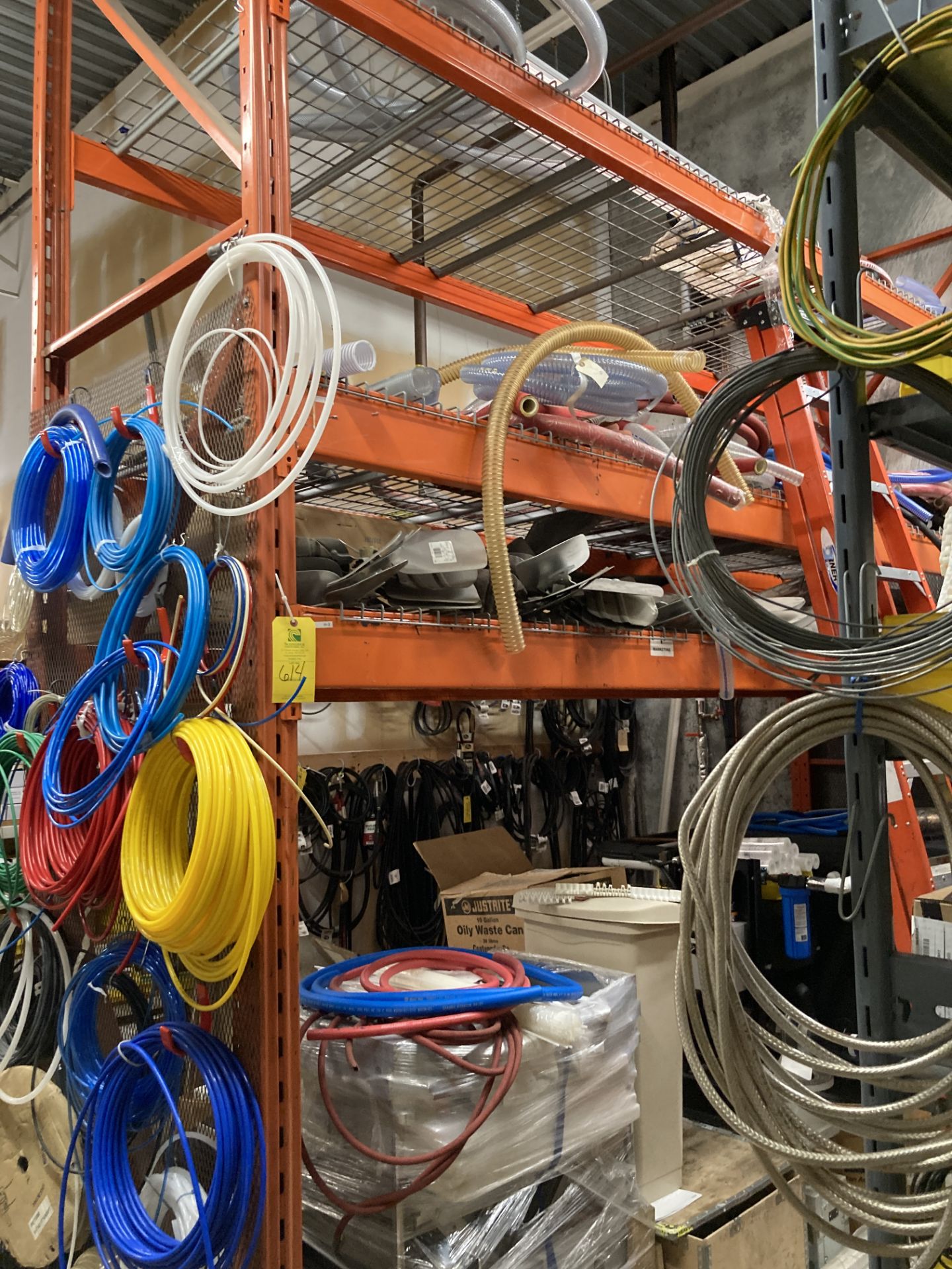LOT OF pallet racking with contents tubing, hoses, fan blades, gearbox ...