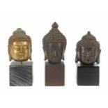 3 variierende Buddhaköpfe China,