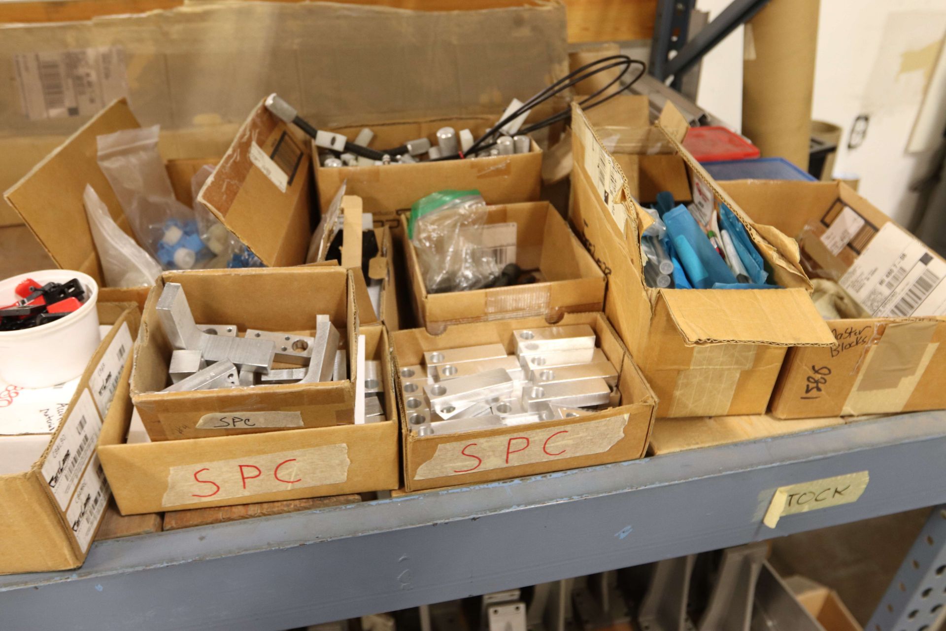 Contents of top of middle shelf of pallet racking including mounting ...