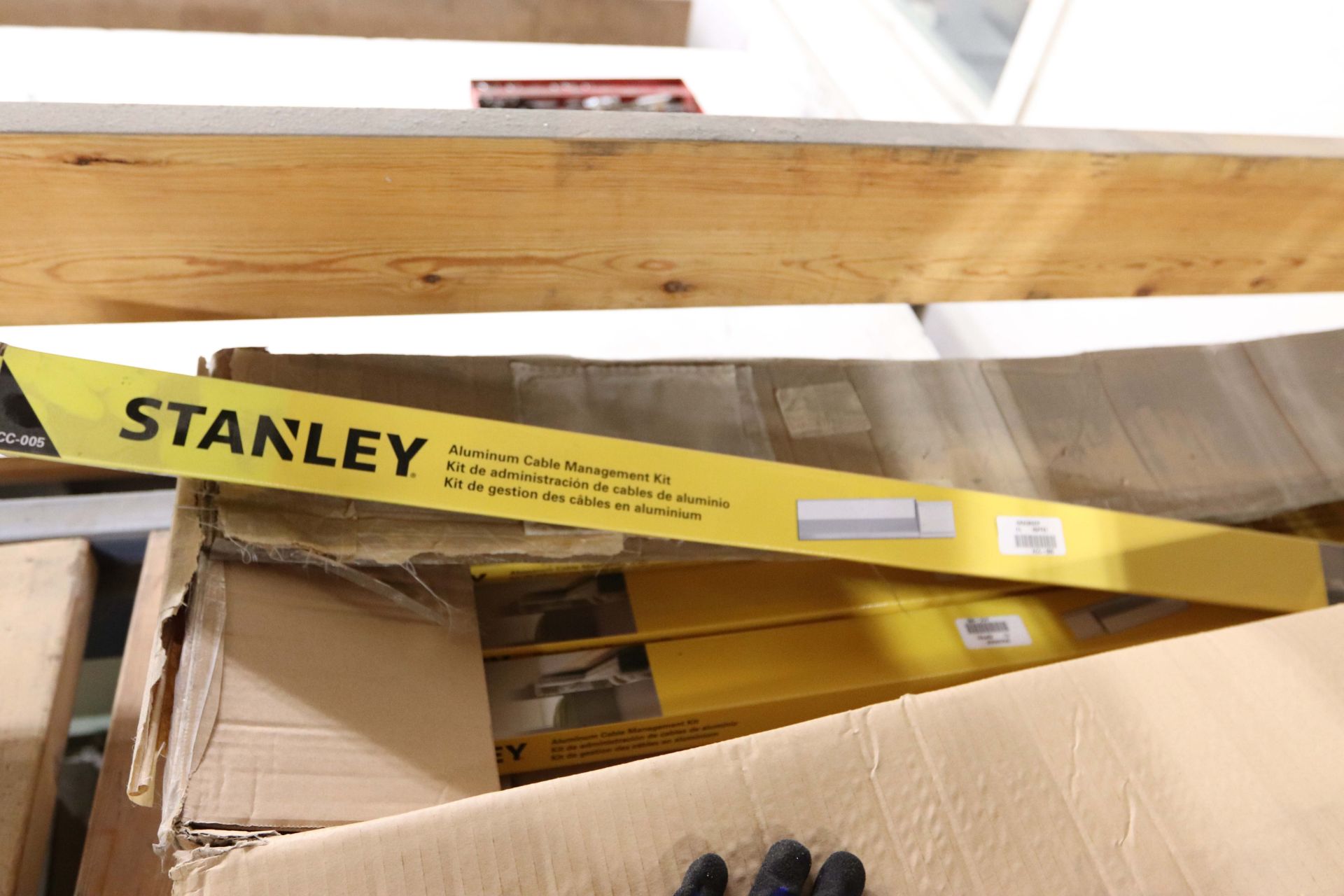 Contents of top of middle shelf of pallet racking including mounting ...