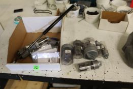 Varying size pole saw bits, Suspa pneumatic arm, model 1801, and a Senstronic proximity sensor, mode