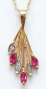 A 9ct gold ruby and diamond pendant on a chain, 1.6g
