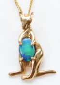 A 14K gold opal doublet kangaroo pendant on a chain, 1.6g