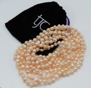 TJC, a 260cm long pearl necklace, in a pouch