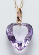 An amethyst heart pendant on a 9ct gold chain, 13mm, 1.8g
