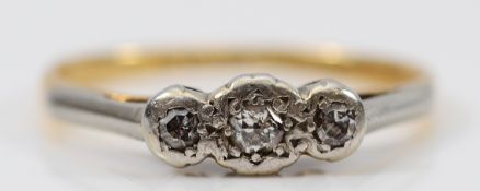 An 18ct gold and platinum old cut diamond three stone ring, K, 1.8g