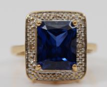 A 9ct gold synthetic sapphire and diamond cluster ring, 14mm x 12mm ring front, I, 4.1g