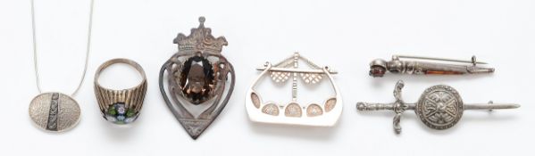 Ola Gorie, a sterling silver pendant on a chain, an Ola Goria silver longboat brooch, Edinburgh