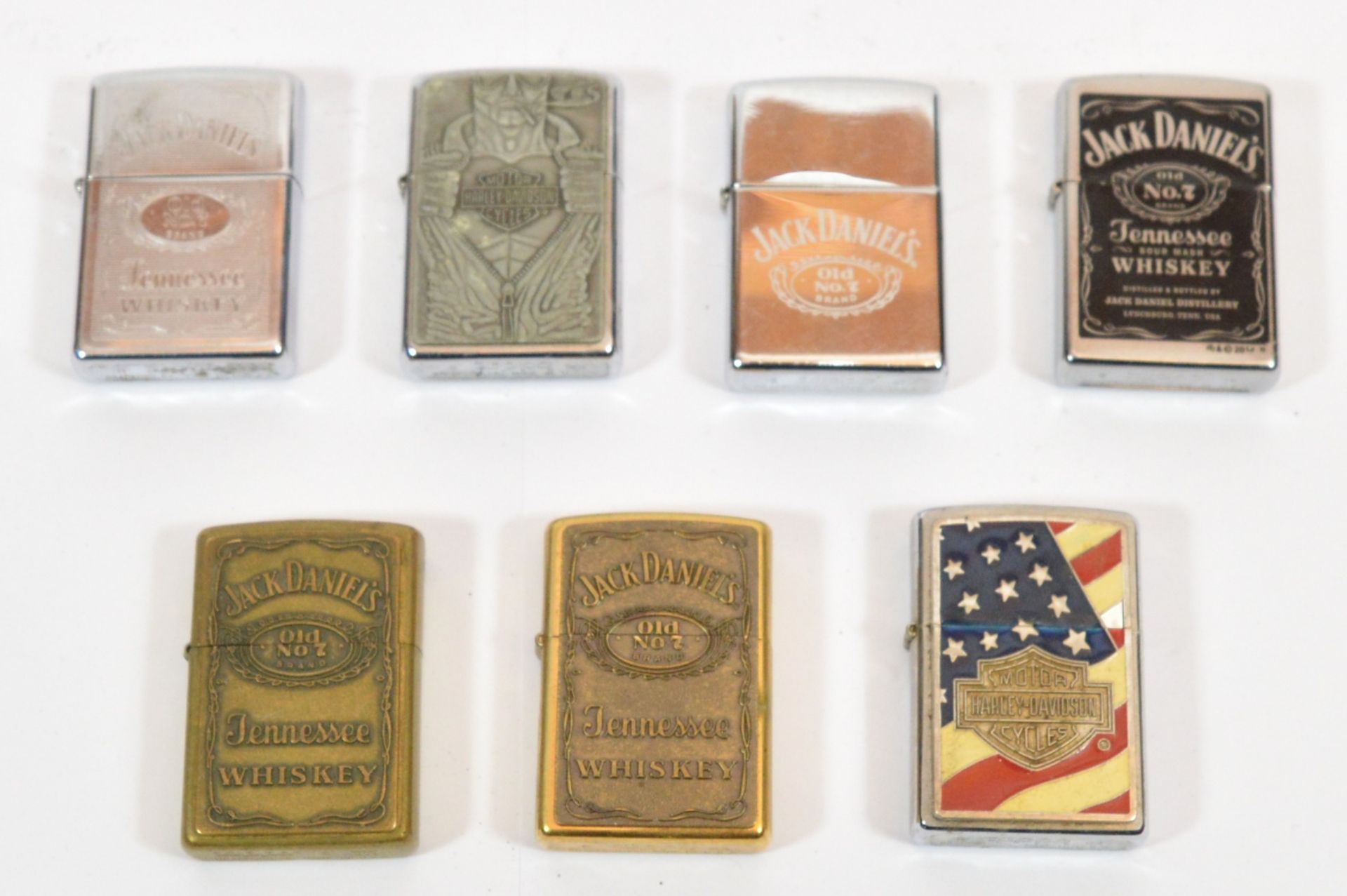 Zippo U.S.A; Seven Zippo pocket cigarette lighters, including advertising Jack Daniel's, Harley