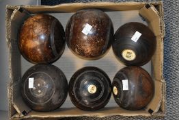Two boxes of vintage wooden bowls in varied sizes.