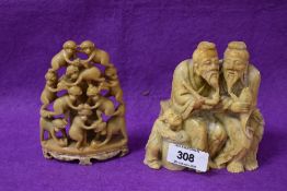 An early 20th century Chinese carved soapstone sculpture of two fishermen and small boy, h11cm, sold