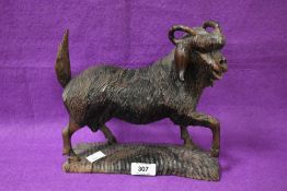 A Black Forest style carving of a mountain goat, L26cm x H22cm