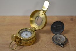 A reproduction brass military compass, sold alongside another smaller compass with J G L Summer 1936