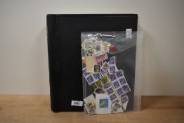 A folder containing various used stamps, to include Canada 39, Her Majesty the Queen Sixtieth