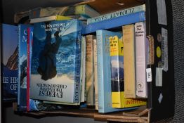 An assortment of books on mountains and hills including titles 'Everest The Hard Way' Chris
