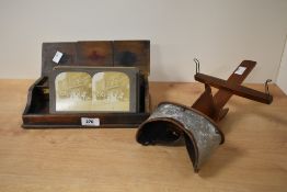 A late 19th / early 20th stereoscope with oak ink box and 28 photography cards, to include