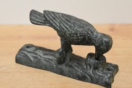 A reproduction cast iron woodpecker door knocker, h16cm