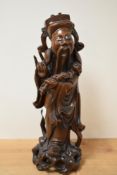 An early 20th century Chinese Buddhist immortal sculpture, intricately carved from hardwood