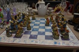 A 32 piece Walt Disney chess board, to include figures such as Minnie, Pluto, Goofy and Micky Mouse