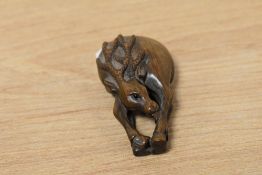 A Japanese carved fruitwood netsuke deer, signed on bone to the reverse, h5.5cm