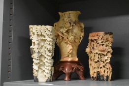 A group of three Chinese carved soapstone vases, each carved in relief with foliage, largest 27.5cm