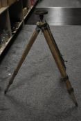 A 19th century heavy brass telescope and part wood and brass tri-pod stand, indistinctly marked G