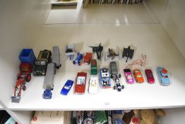 A collection of playworn die-casts including Corgi Massey Ferguson 165 with loading shovel,