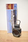 A Railway Signal Oil Lamp, height 25cm along with a Italeri No 150 1:720 scale plastic kit, USS