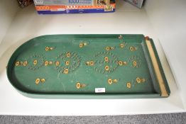 A Chad Valley Bagatelle Board with ball bearing present