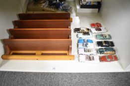 A Danbury Mint Classic Cars of the 50's set on wooden display shelf, all 12 cars present