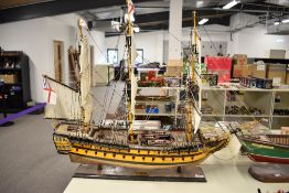 A large wooden model British Naval Warship, HMS Agamemnon on wooden stand, height 70cm, length 90cm,