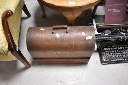 A vintage Singer sewing machine in domed case