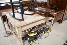 A modern limed oak kitchen table having integral butchers block, very heavy, approx. 152 x 97cm