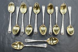 A cased set of twelve Victorian silver Old English pattern teaspoons, having gilt bowls and