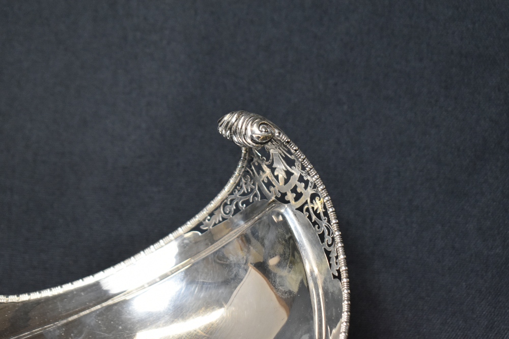 An impressive George V silver bowl, of long boat form having an egg and dart rim with scroll - Image 3 of 5