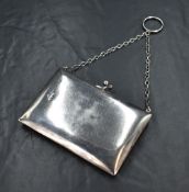 A late Edwardian silver purse, of hinged rectangular form with a pressure ball closure, marks for