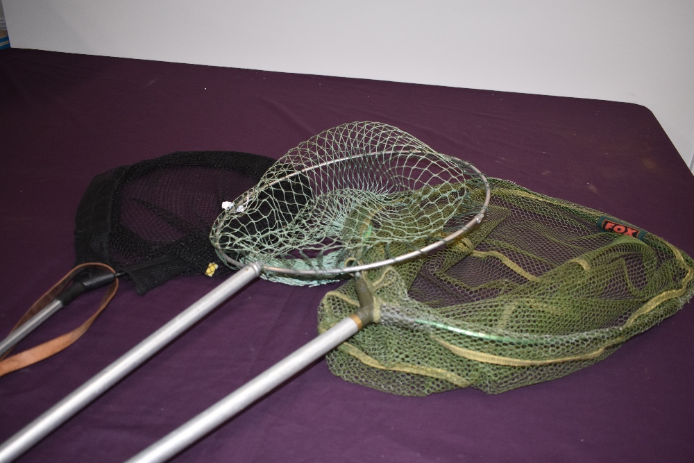 Three landing nets of various sizes