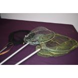 Three landing nets of various sizes