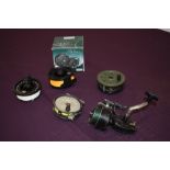 A Shakespeare Alpha fly reel in box with spare spool and 3 other vintage reels